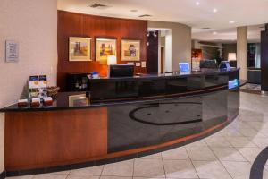 a lobby with a reception desk in a hotel at Courtyard by Marriott San Luis Obispo in San Luis Obispo