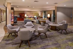 a lobby with chairs and a waiting room at Courtyard by Marriott San Luis Obispo in San Luis Obispo