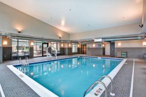 a large pool with blue water in a hotel at Residence Inn by Marriott Cleveland Airport/Middleburg Heights in Middleburg Heights