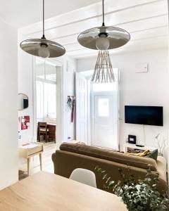 a living room with a couch and a table at Beach & Castle - Sines Apartment in Sines