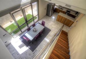 an overhead view of a dining table and pink chairs at Modern Villa Frontline Golf in Algorfa