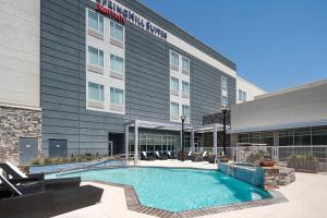 a hotel swimming pool in front of a building at SpringHill Suites by Marriott Midland Odessa in Midland