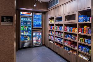 a store aisle with a refrigerator and lots of drinks at Fairfield Inn & Suites by Marriott Staunton in Staunton