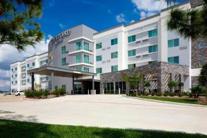 a rendering of the front of the hotel at Courtyard by Marriott Houston Intercontinental Airport in Houston