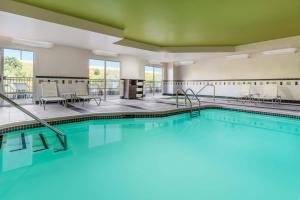 a pool in a hotel room with at Fairfield by Marriott Peoria East in Peoria