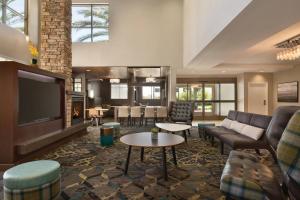 a living room with couches and a tv at Residence Inn San Diego North/San Marcos in San Marcos