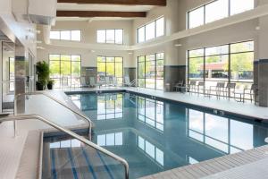 a large pool with blue water in a building at Residence Inn by Marriott Virginia Beach Town Center in Virginia Beach