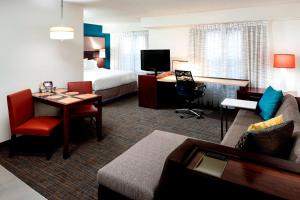 a hotel room with a bed and a couch and a desk at Residence Inn Denver Highlands Ranch in Highlands Ranch