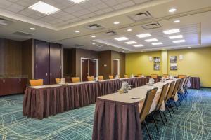 a conference room with long tables and chairs at SpringHill Suites Arundel Mills BWI Airport in Hanover