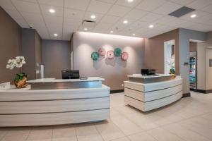 a lobby with donuts on the wall at Residence Inn by Marriott Cincinnati Midtown/Rookwood in Cincinnati