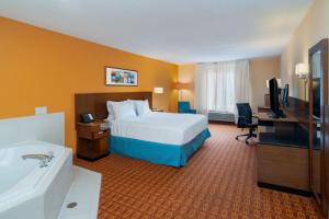 a hotel room with a bed and a sink at Fairfield Inn and Suites by Marriott Nashville Smyrna in Smyrna