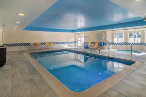 a large swimming pool with a blue ceiling at Fairfield Inn and Suites by Marriott Nashville Smyrna in Smyrna