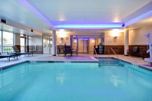 a large swimming pool in a hotel at Fairfield Inn & Suites by Marriott Plymouth in Plymouth