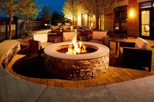 a fire pit in the middle of a patio at Courtyard Hamilton in Hamilton