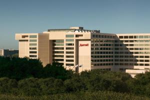 a large building with a namazon sign on it at Houston Marriott Westchase in Houston