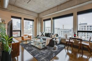 a living room with a couch and a table at Sable 68 - One Bedroom in Minneapolis