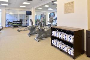 an empty gym with towels on shelves in a room at Springhill Suites by Marriott Detroit Metro Airport Romulus in Romulus
