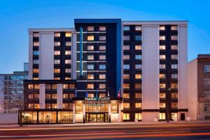 a rendering of a building with lights on at Fairfield Inn by Marriott Montreal Downtown in Montreal