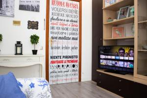 Et tv og/eller underholdning på [1km dalla Torre] Appart. con balcone e posto auto