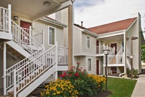 a row of houses with white balconies and flowers at Residence Inn Philadelphia Valley Forge in Berwyn