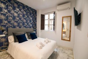 Granadi Apartamentos客房内的一张或多张床位