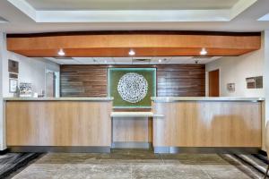 a lobby with wood paneling and a waiting area at Fairfield Inn & Suites Woodbridge in Avenel