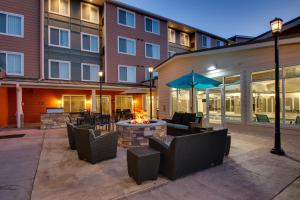 a patio with a fire pit in front of a building at Residence Inn by Marriott Philadelphia Valley Forge/Collegeville in Collegeville