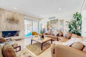 a living room with couches and a fireplace at Indian Wells Elegance in Indian Wells