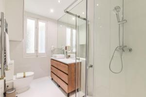 a bathroom with a shower and a sink and a toilet at AP Embajadores XIII in Madrid