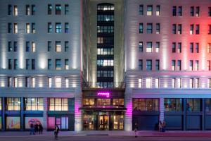 a group of buildings with people walking in front of them at MOXY NYC Times Square in New York