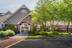 a house with a driveway in front of it at Residence Inn Poughkeepsie in Poughkeepsie