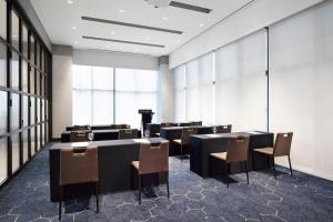 a conference room with tables and chairs and windows at Four Points by Sheraton Josun, Seoul Myeongdong in Seoul