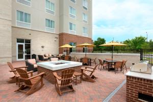 a patio with tables and chairs and umbrellas at Fairfield Inn & Suites by Marriott Rock Hill in Rock Hill