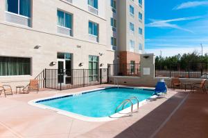 a swimming pool in front of a building at Fairfield Inn & Suites by Marriott Rock Hill in Rock Hill