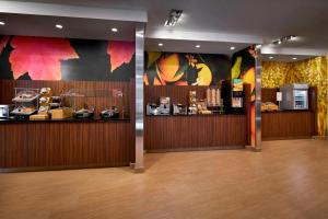 a restaurant lobby with a counter and a kitchen at Fairfield Inn & Suites by Marriott Alexandria,Virginia in Alexandria