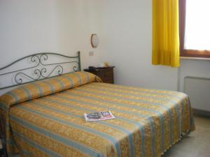A bed or beds in a room at Hotel I Platani