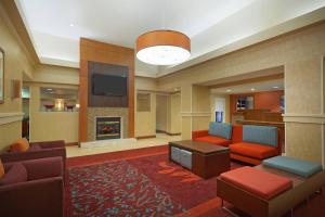 a lobby with a living room with a fireplace at Residence Inn Houston by The Galleria in Houston
