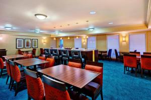 a dining room with tables and chairs in a hotel at Residence Inn Houston by The Galleria in Houston
