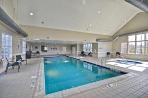 a large swimming pool in a hotel room at Residence Inn Saint Louis O'Fallon in O'Fallon