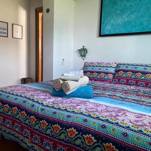 A bed or beds in a room at Terra Aloé