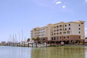 a large building with boats docked in a marina at Courtyard by Marriott St. Petersburg Clearwater/Madeira Beach in St. Pete Beach