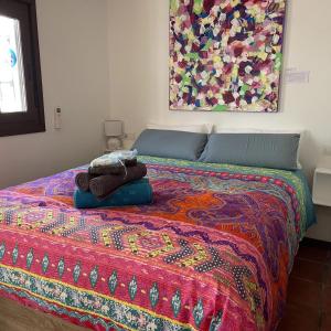 A bed or beds in a room at Terra Aloé