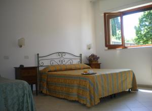 A bed or beds in a room at Hotel I Platani