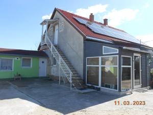 a house with a staircase on the side of it at Bei Hanna in Enying