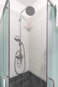 a shower in a bathroom with a glass door at Cool Suite in Split +20 photos