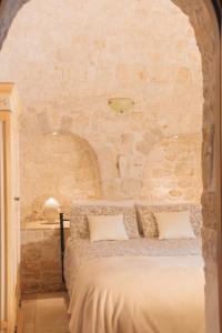 Postel nebo postele na pokoji v ubytování Masseria Montanaro