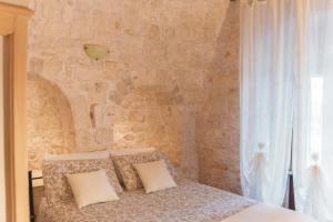 Postel nebo postele na pokoji v ubytování Masseria Montanaro