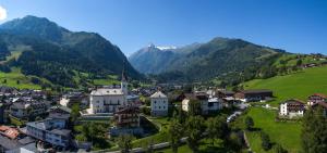 an aerial view of a village in the mountains at Pension Monika, Kaprun, incl Summercard in Kaprun