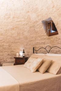 Postel nebo postele na pokoji v ubytování Masseria Montanaro