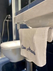 a bathroom with a toilet and a towel on a sink at Casa Vacanze Armanda in Lerici